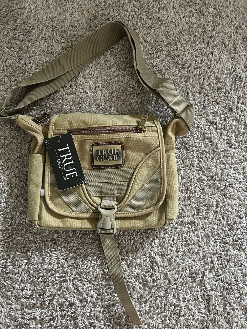Tan/khaki  Messenger crossbody Bag with Adjustable Strap. Waterproof liner